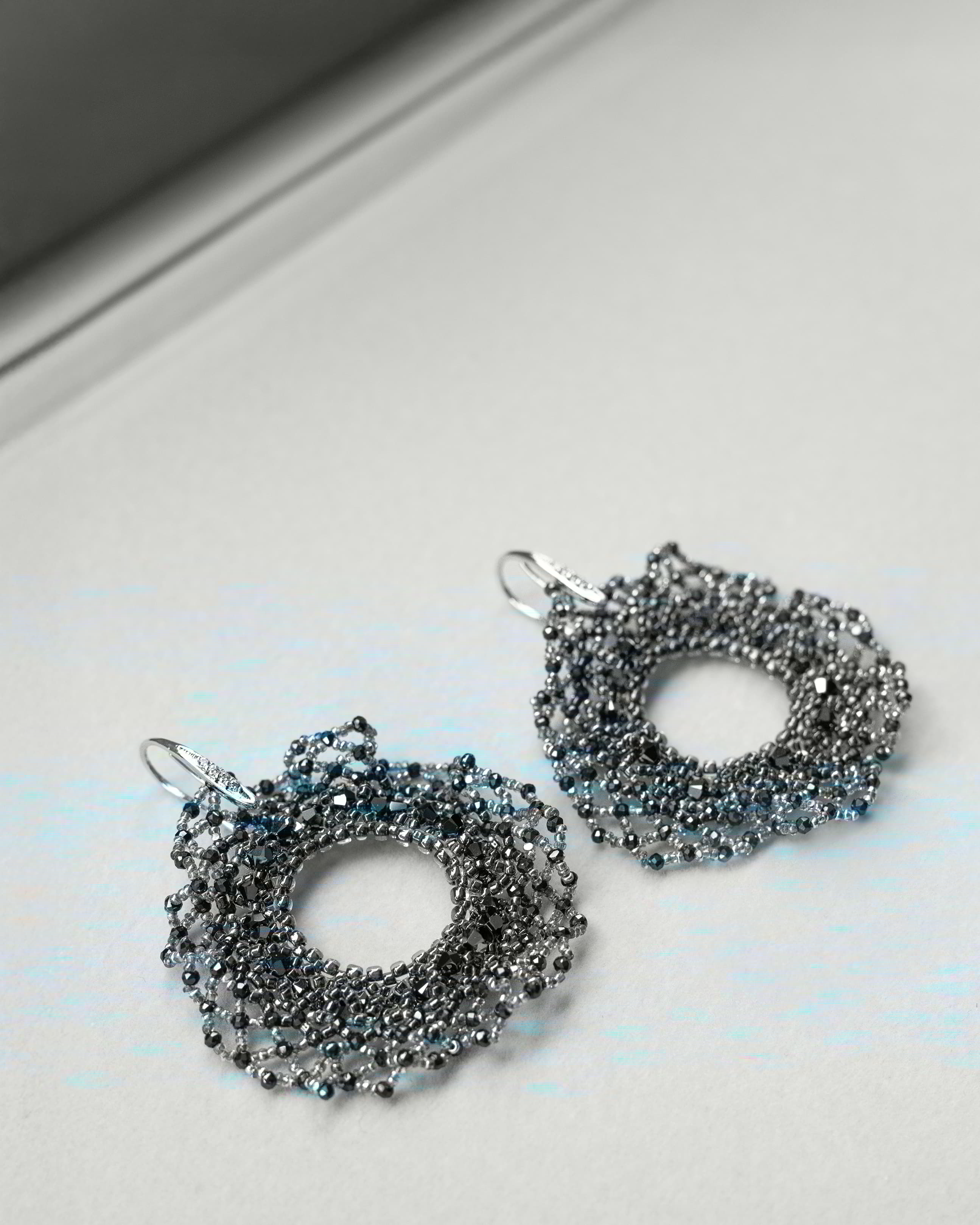 Round beaded earrings with crystals