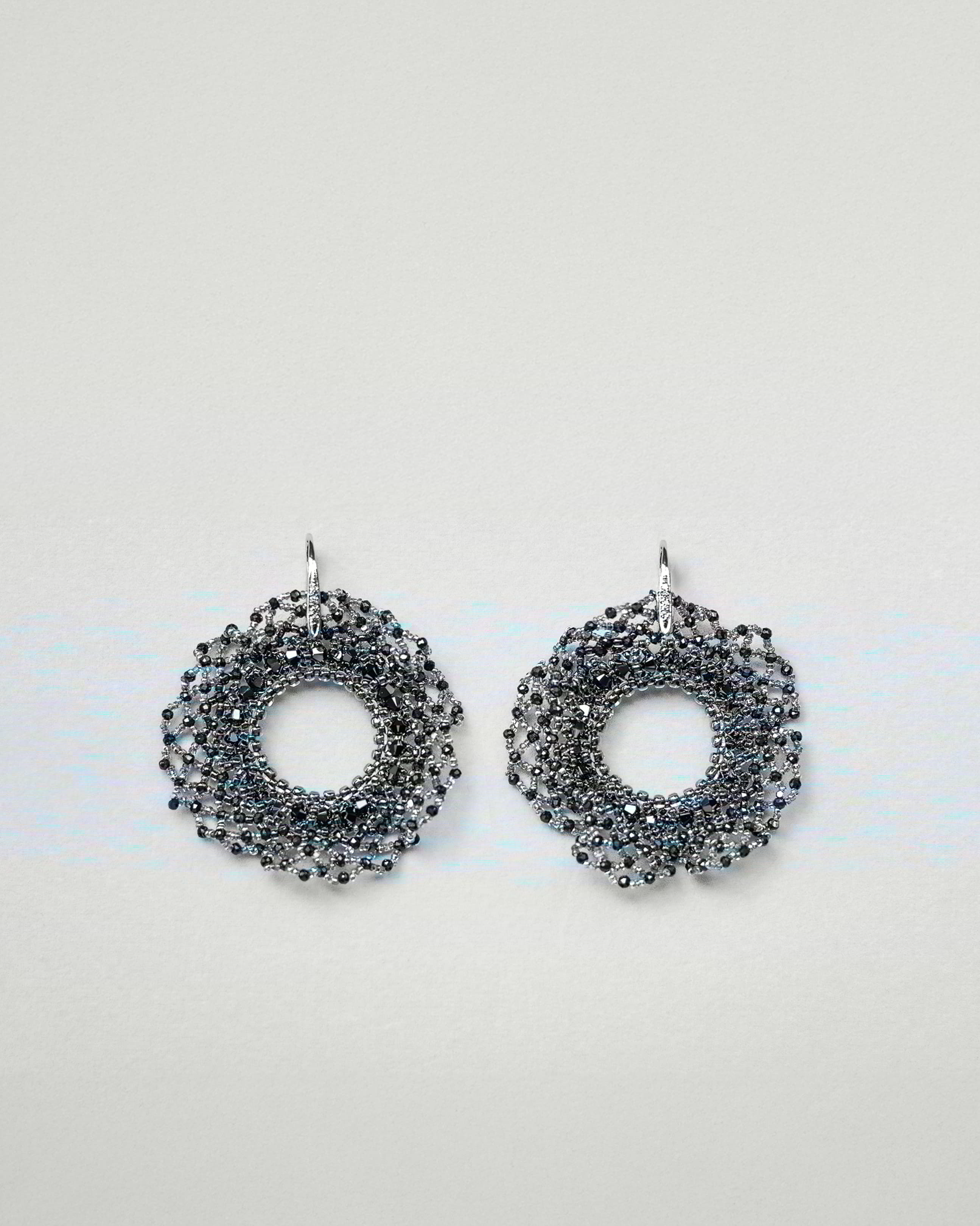 Round beaded earrings with crystals