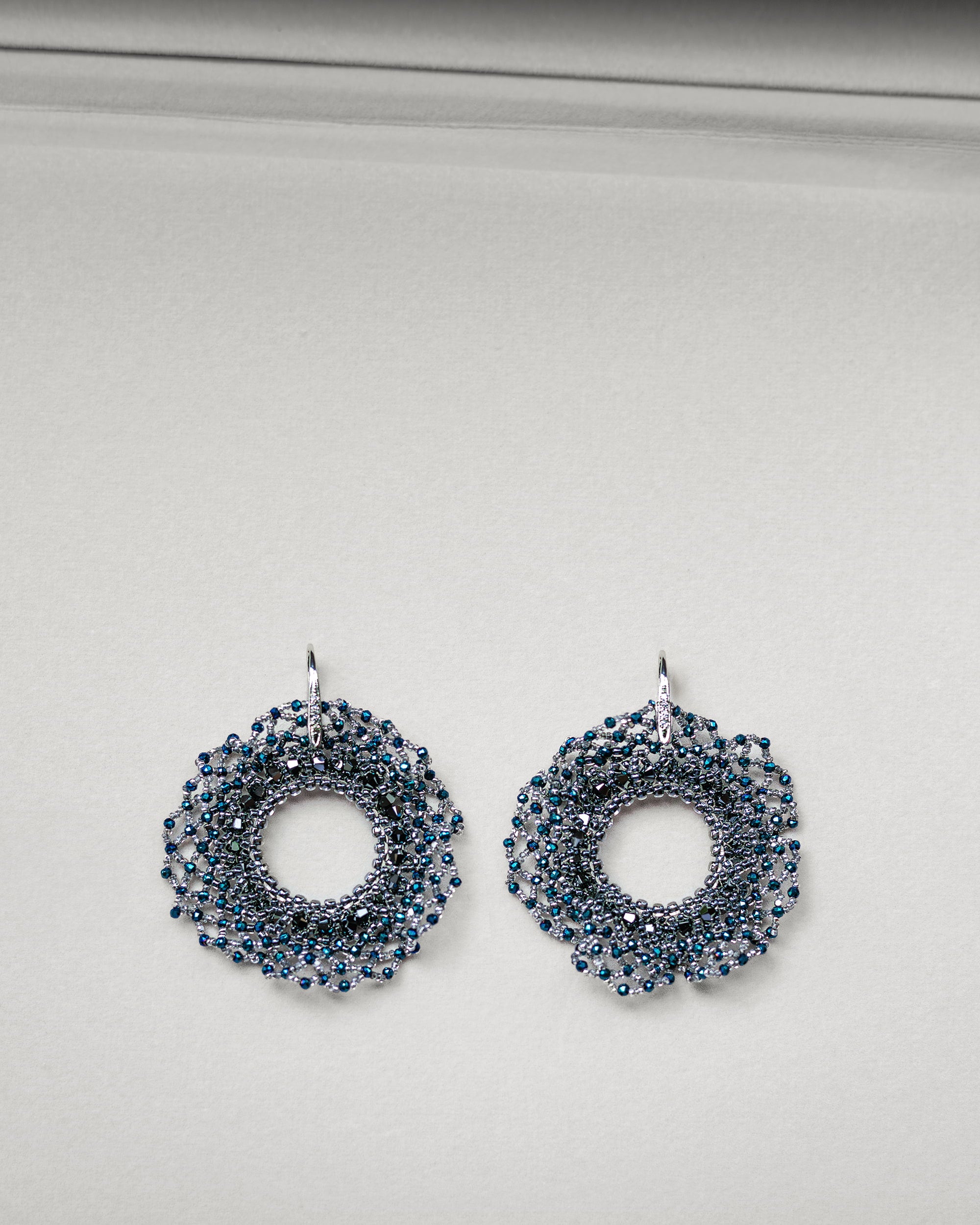 Round beaded earrings with crystals