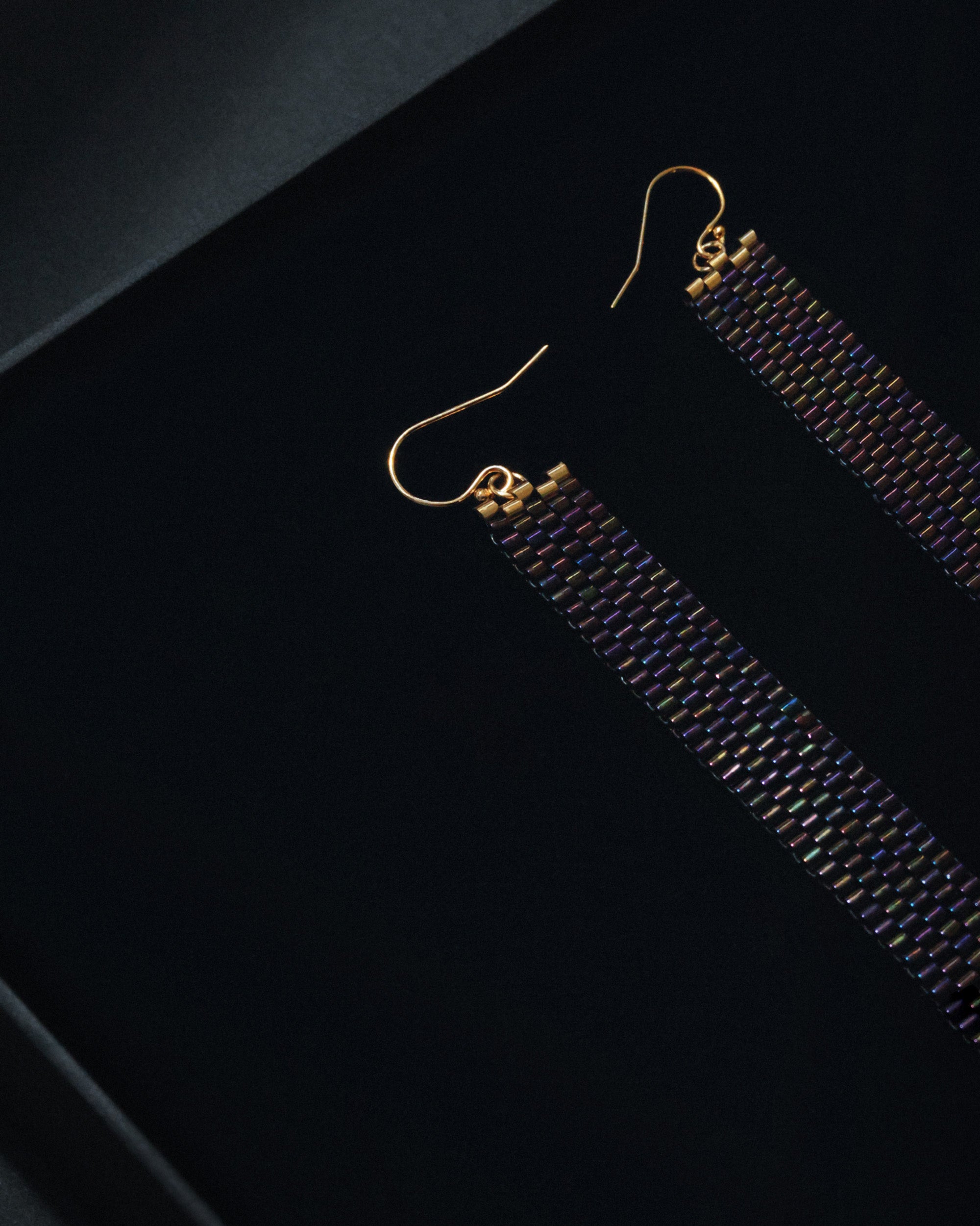 Close-up look of HELGA-DESIGN brand handcrafted beaded exquisite earrings