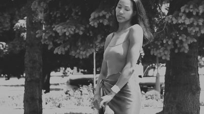 Cinematic showcase of HELGA-DESIGN luxury silk scarves and artisan jewelry, featuring hand-painted floral and ornamental patterns by artist Olga Ibadullayeva.